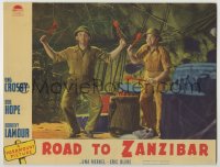 9k773 ROAD TO ZANZIBAR LC 1941 close up of zany Bob Hope & Bing Crosby about to hit jungle drums!