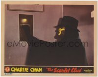 9k797 SCARLET CLUE LC 1945 super close up of the masked villain pulling switch, Charlie Chan!