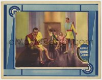 9k893 THINGS TO COME LC 1936 Raymond Massey & others wearing clothes of the future, H.G. Wells!