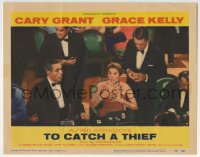 9k905 TO CATCH A THIEF LC #8 1955 Cary Grant behind woman at casino baccarat table, Alfred Hitchcock