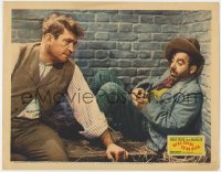 9k949 WE'RE GOING TO BE RICH LC 1938 close up of Victor McLaglen staring at his cell mate in jail!