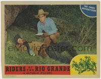 1a781 RIDERS OF THE RIO GRANDE LC 1943 cowboy Bob Steele kneeling over dead guy & reading letter!