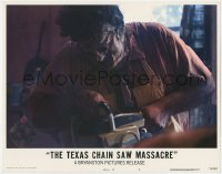 1a895 TEXAS CHAINSAW MASSACRE LC #7 1974 c/u of Gunnar Hansen as Leatherface holding chainsaw!