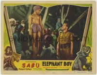 1k363 ELEPHANT BOY LC #3 R1947 Sabu standing on rock & looking down at man, Rudyard Kipling!
