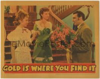 1k429 GOLD IS WHERE YOU FIND IT LC 1938 George Brent brings flowers to Olivia De Havilland & Lindsay