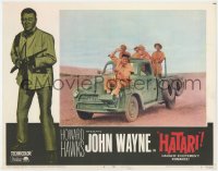 1k458 HATARI LC #2 R1967 great image of John Wayne trying to lasso big game from front of truck!
