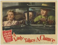 1k556 LADY TAKES A CHANCE LC 1943 John Wayne driving car with Jean Arthur & Charles Winninger!