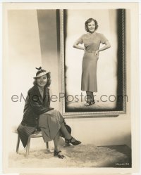 1t617 MADGE EVANS 8x10.25 still 1930s modeling her choice in sports wear by a portrait of herself!