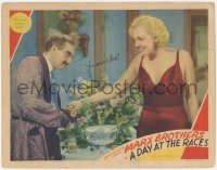 2c205 DAY AT THE RACES signed LC 1937 by Groucho Marx, who's giving tomato juice to Esther Muir!