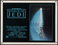 2d325 RETURN OF THE JEDI 1/2sh 1983 George Lucas, art of hands holding lightsaber by Tim Reamer!