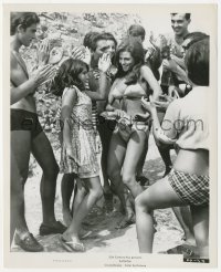 2h328 FATHOM 8.25x10 still 1967 sexy Raquel Welch in bikini partying with people on the beach!