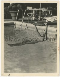 2h503 JOAN CRAWFORD 8x10.25 still 1920s relaxing in her swimming pool at her Hollywood home!