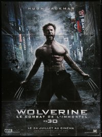 2k985 WOLVERINE teaser French 1p 2013 Hugh Jackman as Logan kneeling with his claws extended!