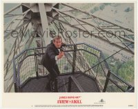 2m957 VIEW TO A KILL LC #1 1985 Roger Moore as James Bond with gun drawn on Eiffel Tower!