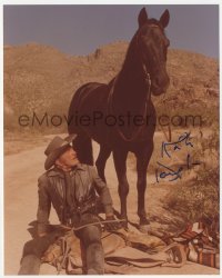 3f1076 KIRK DOUGLAS signed color 8x10 REPRO still 1990s seated outdoors by his horse in The Villain!