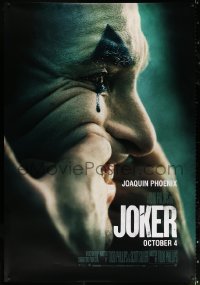 3k0101 JOKER DS bus stop 2019 different image of clown Joaquin Phoenix putting on a happy face!