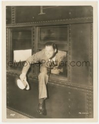 3r0329 JOHNNY WEISSMULLER 8x10.25 still 1930s climbing out train window as he arrived in New York!