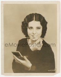 3r0480 RAQUEL TORRES 8x10.25 still 1930 applying lip rouge with outline of her lips made from wood!