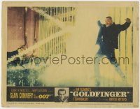 3r1155 GOLDFINGER LC #3 1964 Sean Connery as James Bond watches Oddjob get electrocuted on fence!