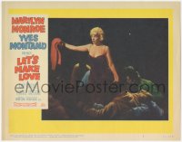3r0026 LET'S MAKE LOVE LC #8 1960 sexy Marilyn Monroe standing in pile of men & holding out sweater!