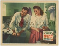 3r1261 MIRACLE ON 34th STREET LC #6 1947 Maureen O'Hara is amused by John Payne in the kitchen!