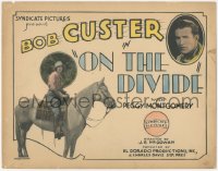 3r0864 ON THE DIVIDE TC 1928 great image of cowboy Bob Custer & Peggy Montgomery on horse, rare!