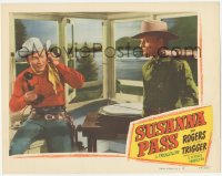 3r1408 SUSANNA PASS LC #6 1949 c/u of guy wearing badge standing by Roy Rogers talking on phone!
