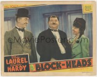 3z0584 BLOCK-HEADS LC 1938 winking Oliver Hardy shows Stan Laurel he has a way with the ladies!