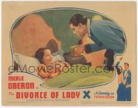 3z0720 DIVORCE OF LADY X LC 1938 Laurence Olivier looking angrily at Merle Oberon in bed!