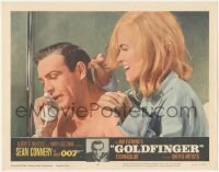 3z0806 GOLDFINGER LC #2 1964 c/u of sexy Shirley Eaton behind Sean Connery as James Bond on phone!
