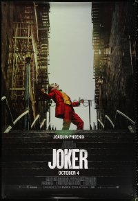 4g0091 JOKER DS bus stop 2019 Joaquin Phoenix as the DC Comics villain at the top of the stairs!