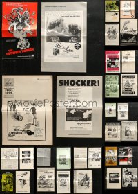 4h0992 LOT OF 31 UNCUT PRESSBOOKS 1940s-1980s advertising for a variety of different movies!