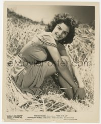 4w1528 OUTLAW 8x10.25 still 1946 sexy smiling portrait of Jane Russell sitting in hay, Howard Hughes