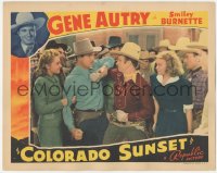 4w0445 COLORADO SUNSET LC 1939 close up of cowboy Gene Autrey getting tough with Buster Crabbe!