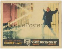 4w0546 GOLDFINGER LC #3 1964 Sean Connery as James Bond watches Oddjob get electrocuted on fence!