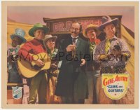 4w0561 GUNS & GUITARS LC 1936 Gene Autry plays guitar during Earle Hodgins' medicine show!