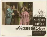 4w0569 HER CARDBOARD LOVER photolobby 1942 Norma Shearer looks at Robert Taylor eating banana!