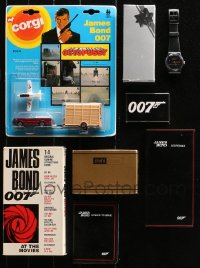 4x0369 LOT OF 7 JAMES BOND MEMORABILIA AND PROMO ITEMS 1980s-1990s toy car, watch, VHS tape & more!
