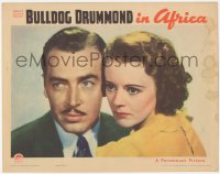 5k0932 BULLDOG DRUMMOND IN AFRICA LC 1938 best close up of detective John Howard & Heather Angel!