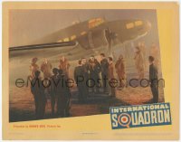 5k1153 INTERNATIONAL SQUADRON LC 1941 Ronald Reagan & several men gathered around airplane!