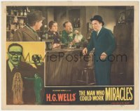 5k1235 MAN WHO COULD WORK MIRACLES LC #5 R1947 worried Roland Young standing at bar, H.G. Wells!