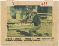5k1363 RIO BRAVO LC #6 1959 c/u of John Wayne & Ricky Nelson in gunfight on street, Howard Hawks