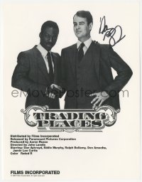 5y0242 DAN AYKROYD signed 9x11 trade ad 1983 shaking hands with Eddie Murphy in Trading Places!