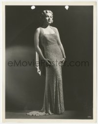6c0986 CLAIRE TREVOR 8x10 still 1934 full-length modeling a sparkling gown over black background!