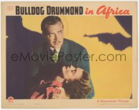 6c0326 BULLDOG DRUMMOND IN AFRICA LC 1938 detective John Howard holding unconscious Heather Angel!