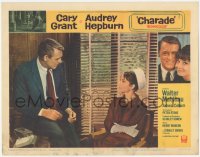 6c0345 CHARADE LC #4 1963 c/u of Cary Grant sitting by worried Audrey Hepburn, Stanley Donen!