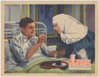 6c0498 I STAND CONDEMNED LC 1936 close up of sick Laurence Olivier feeding soup to his nun nurse!
