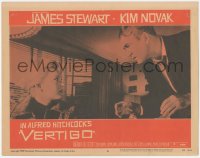 6c0780 VERTIGO LC #8 1958 Alfred Hitchcock, standing James Stewart glares at blonde Kim Novak!
