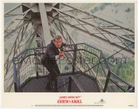 6c0781 VIEW TO A KILL LC #1 1985 Roger Moore as James Bond with gun drawn on Eiffel Tower!