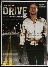 6g0266 DRIVE Italian 1p 2011 best close up of Ryan Gosling as the driver holding hammer!